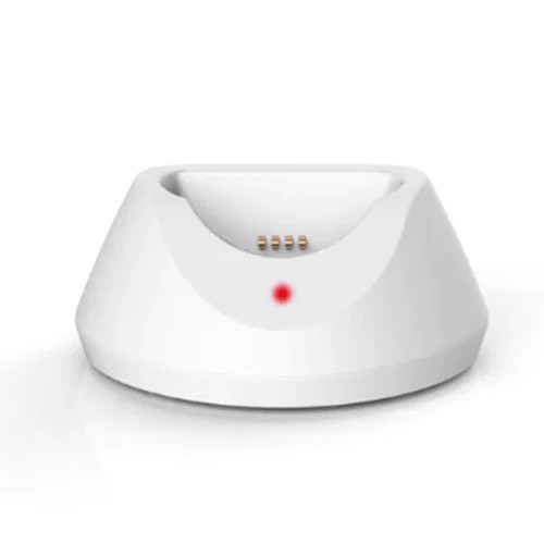 The pendant sitting in its charging cradle.